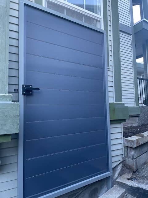 metal panels installation and design of blue fence in Coquitlam