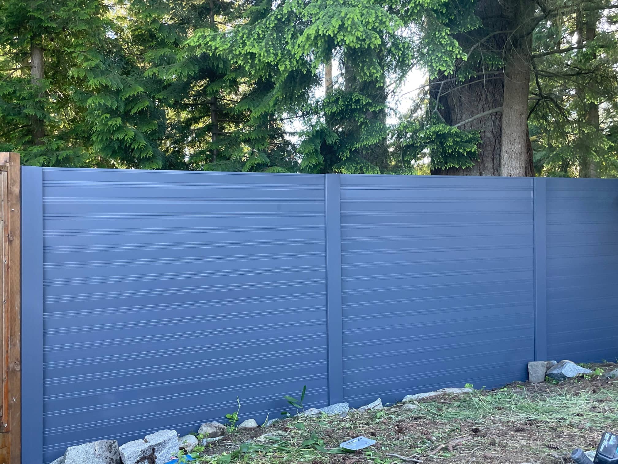 metal panels installation and design of blue fence in Coquitlam