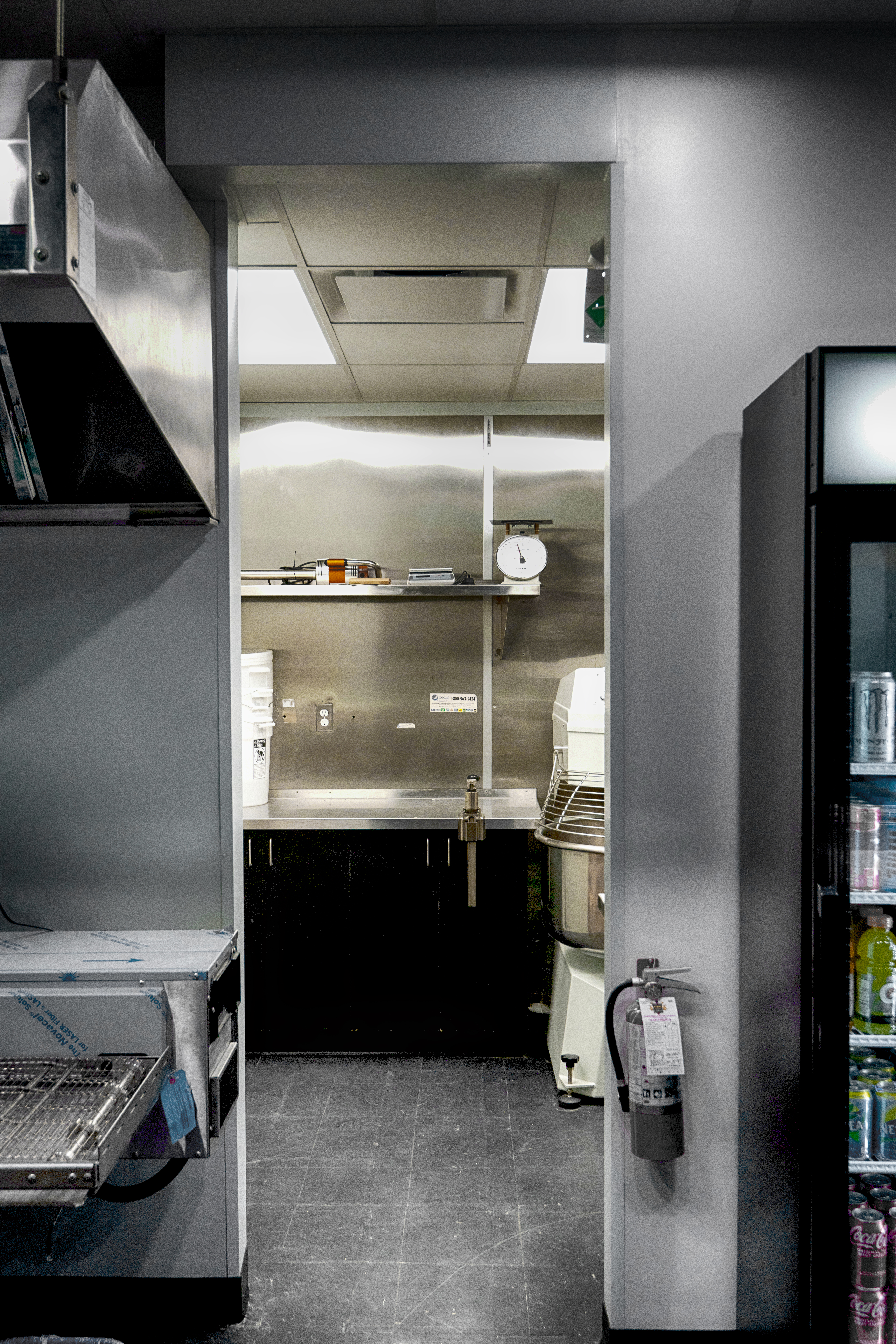 metal panels installation and design of pizza place at the food court in Maple Ridge