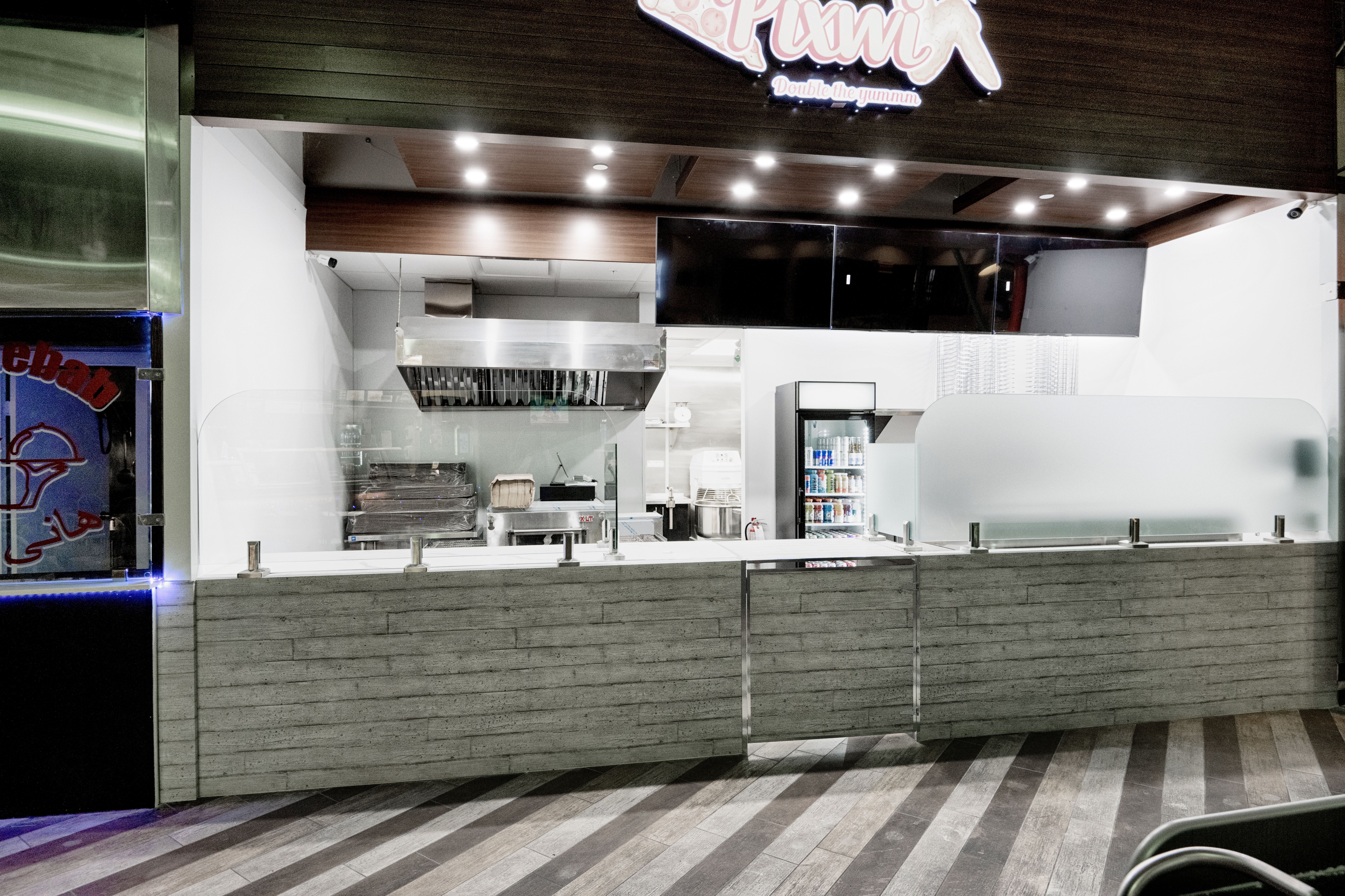 metal panels installation and design of pizza place at the food court in Maple Ridge