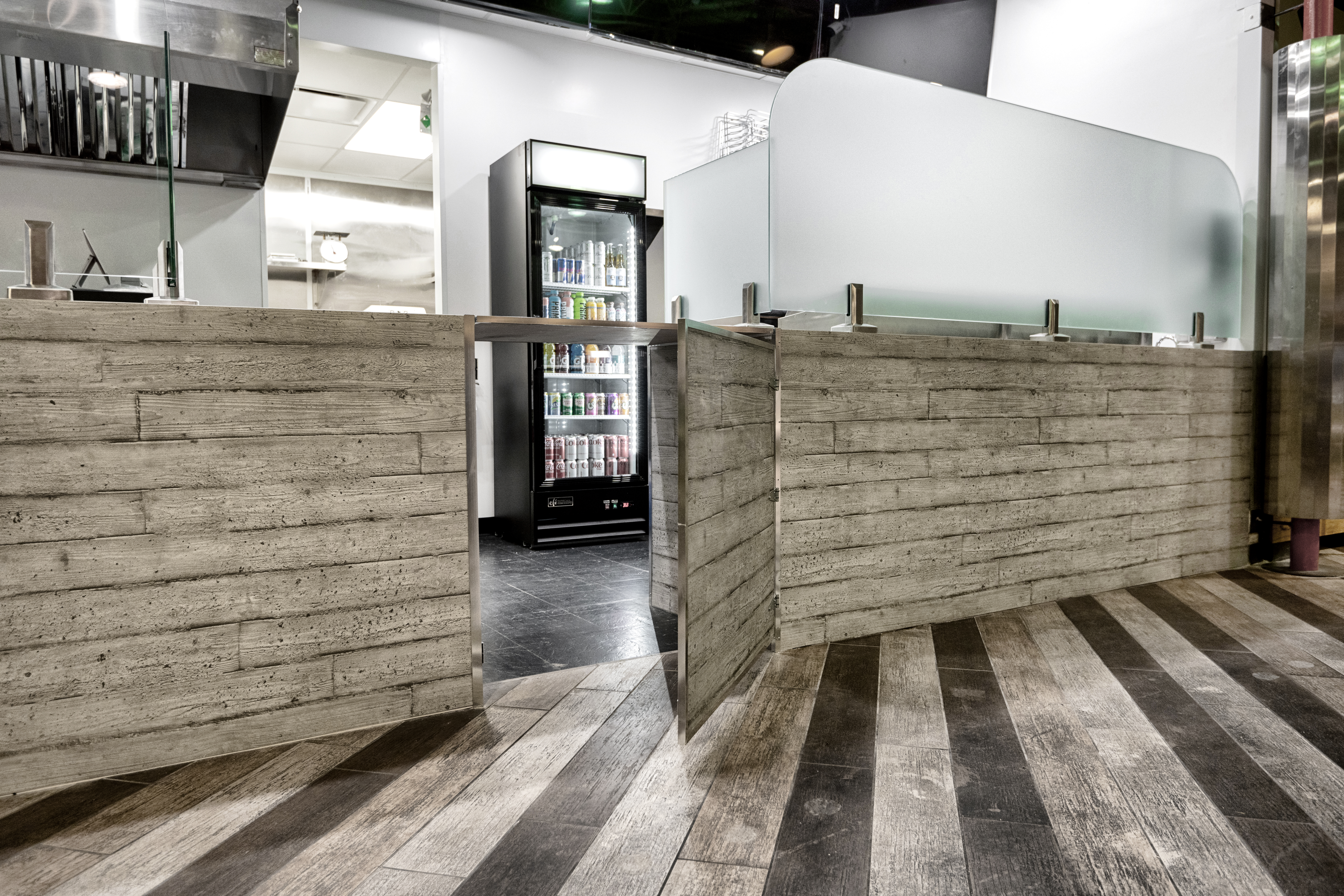 metal panels installation and design of pizza place at the food court in Maple Ridge