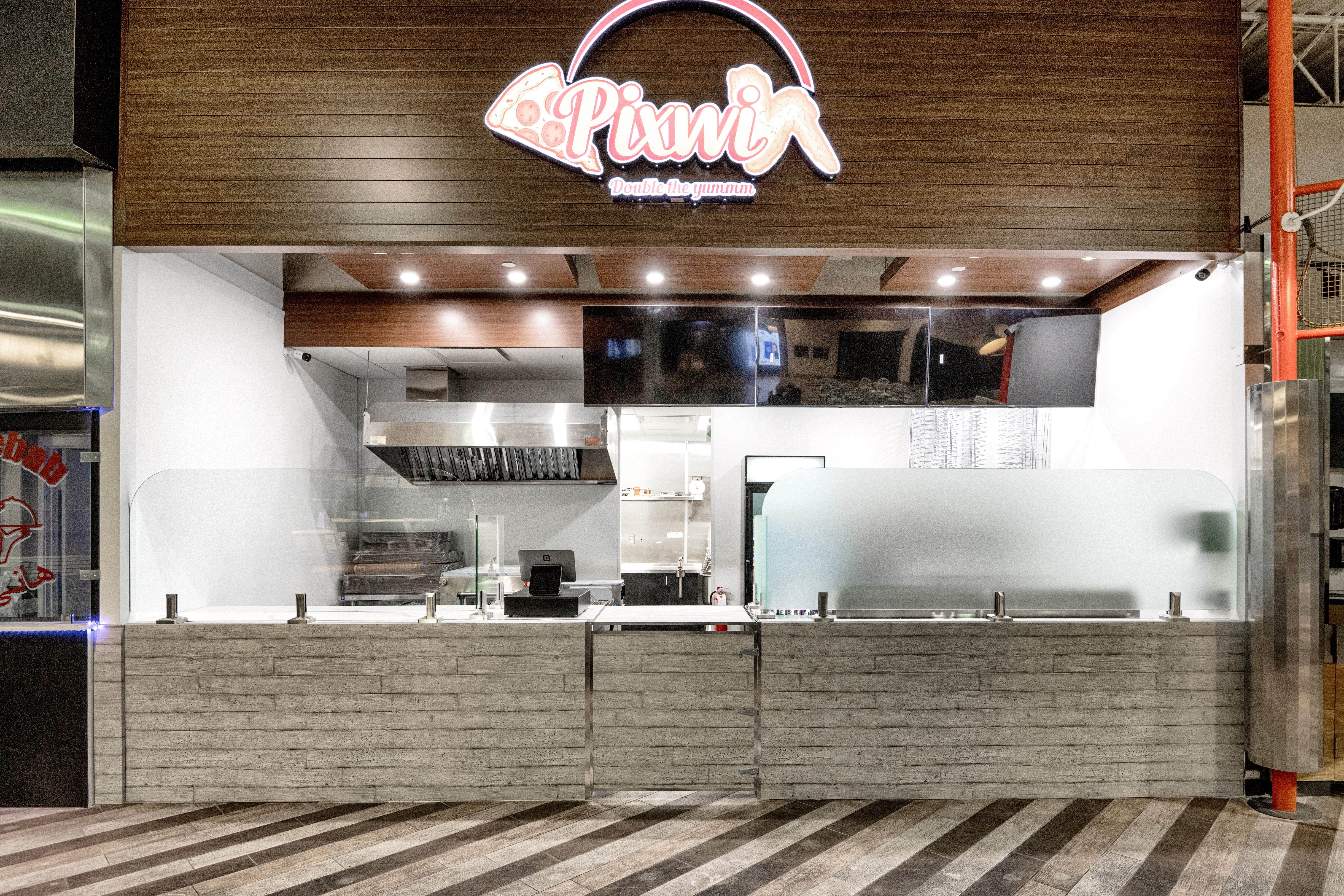 metal panels installation and design of pizza place at the food court in Maple Ridge